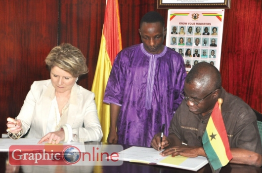 rs Marie Gabrielle Inechen-Fleisch (left), State Secretary of Switzerland, jointly signing the agreement with Dr Joseph Oteng Adjei (right), Minister of Environment, Science, Technology and Innovation, in Accra