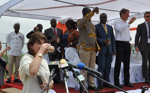 The Dutch Minister for Foreign Trade and Development Cooperation, Ms Lilianne Ploumen proposing a toast with a sip of Cocoa drink to officially launch CORIP