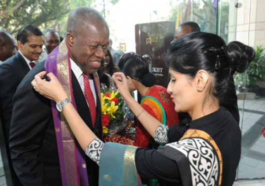 ice President Kwesi Amissah Arthur being decorated with sash on his arrival in India.