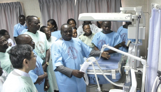 Mr. Nana Yaw Appiah (4th left) Managing Director of Engisys Company, explaining the function of the neonatal equipment to the Japanese Ambassador, Mr. Naoto Nikai, (left), Col. Ralph Ametepi (2nd left) the Commander of the 37 Military Hospital, and other officials.